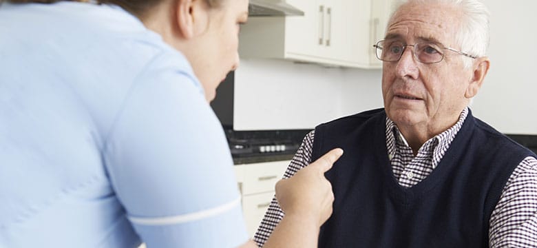 Elderly man being yelled at by woman