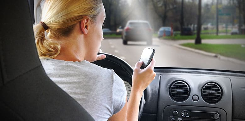 Woman texting and driving