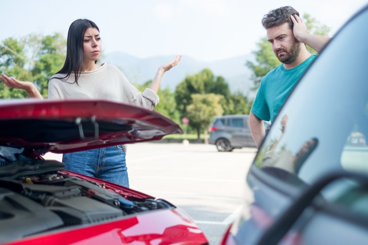 Two people arguing after car accident