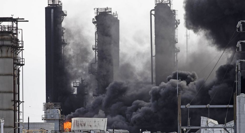 Smoke stacks at factory on fire