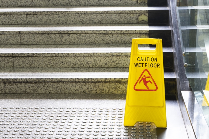 wet floor sign on stairs