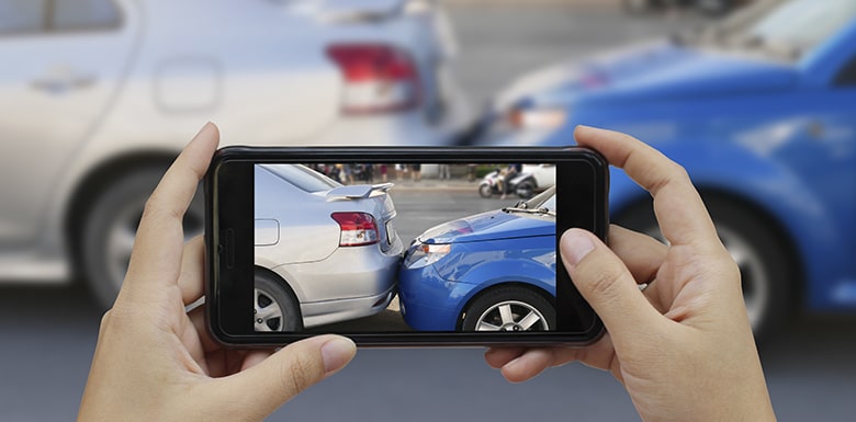 taking picture of car accident on phone