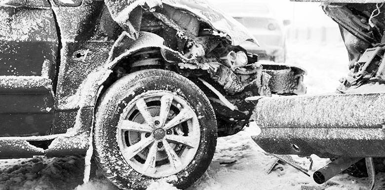 Wrecked cars during a winter storm